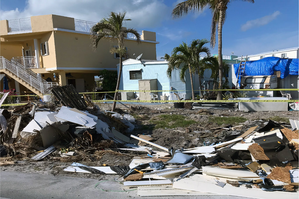 Debris and fallen home on roadside near Key West