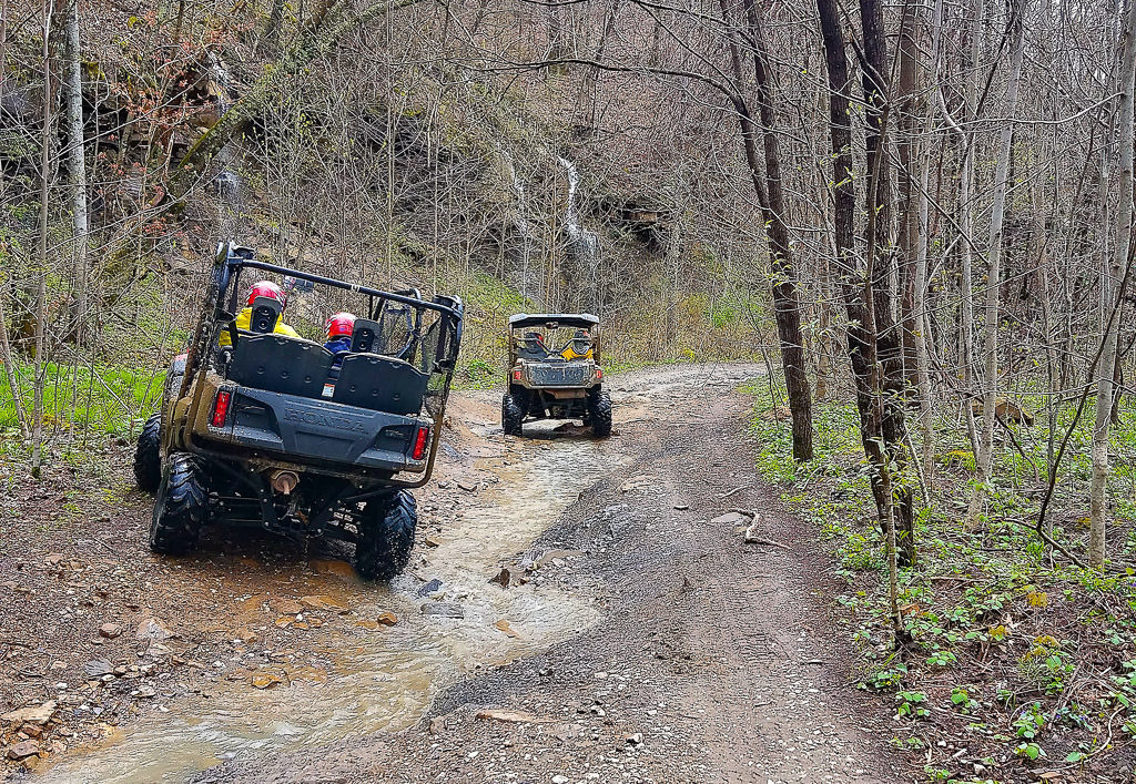 2 ATVs on a trail